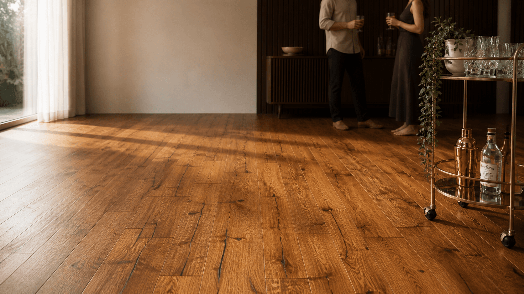 Wide oak plank flooring in a warm living room with evening light